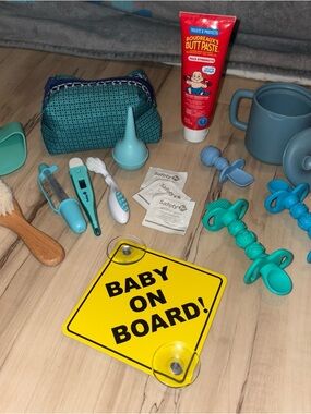 Baby Bundle including Baby On Board Car Window Sign, brushes, first aid travel